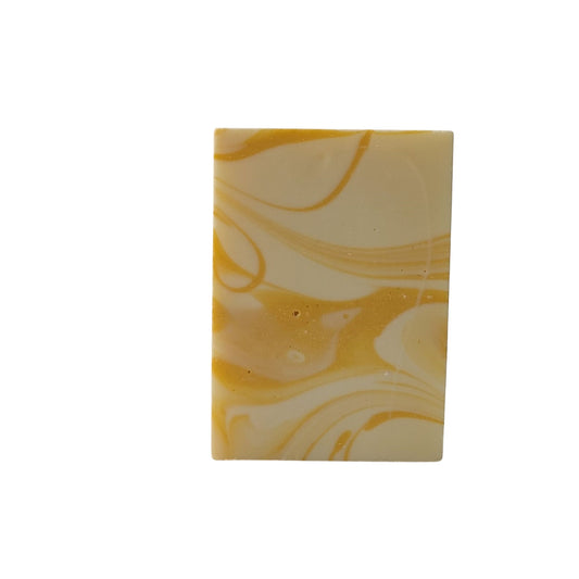 Lemon soap bar with yellow swirls in The Happy Hippy Soap Company packaging